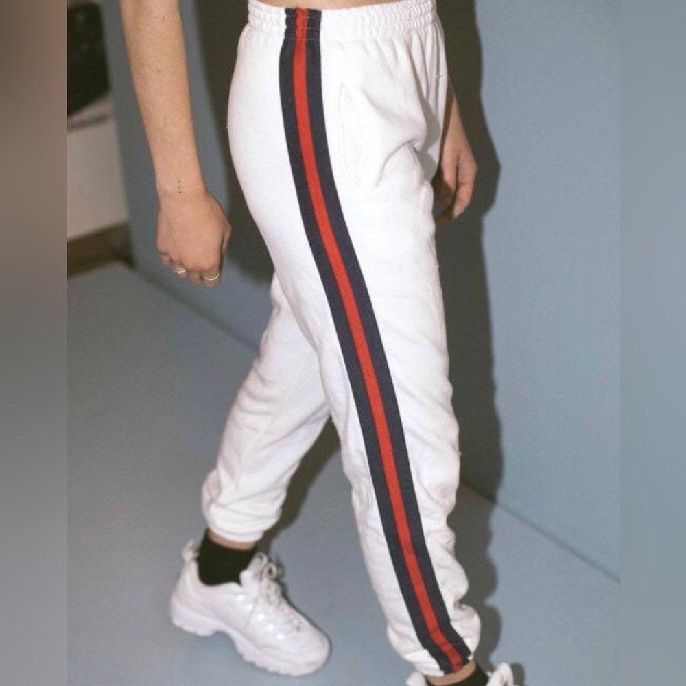 Brandy Melville. White jogger, red and navy blue stripes on the side. One size